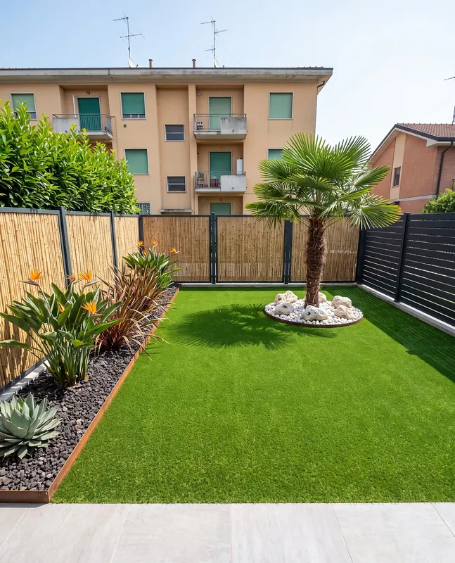 Giardino di 50 m² in prato sintetico a Cernusco sul Naviglio con bordo in corten che separa l'aiuola dal prato, lapillo nero al posto della terra
